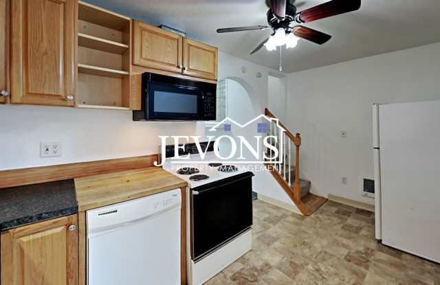 Two-story home in a walkable location, just minutes from Yakima Valley College, featuring long driveway parking