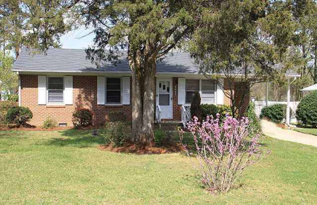 Outdoor Living Dream: Ranch-style home with Deck  Yard