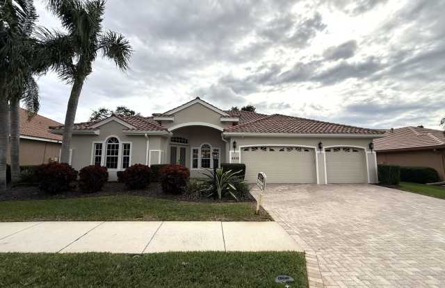 Luxurious 4 Bedroom 3 Bath Lakefront Pool Home W/3-Car Garage