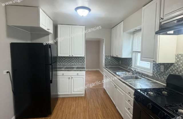 4 Bedroom • 2 Full Bath • 2-Car Garage • Fenced in Yard • Bonus Rooms • Appliances present