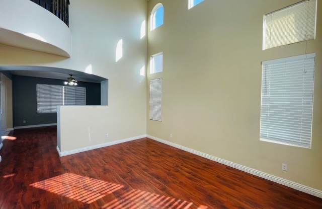 Large 5 bedroom family home right off of Blue Diamond, in gated community, with a full bedroom and bathroom downstairs!