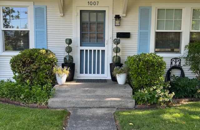 Charming 2 bedroom, 1 bathroom, single story cottage w/oversized garage