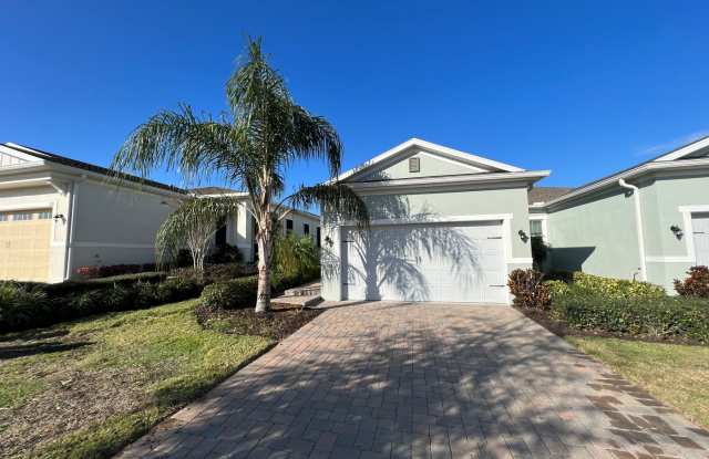 55+ community in Four Seasons of Orlando 2 bedroom, 2 bathroom, with a 2 stall attached garage on a golf course