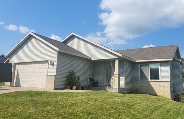 Dogs are welcome no cats this property does not participate in Section 8. Showing start December 1, 2025 and Available February 1, 2026 NW Rochester 4 bedroom 3 bath 2 car attached garage fenced yard!!
