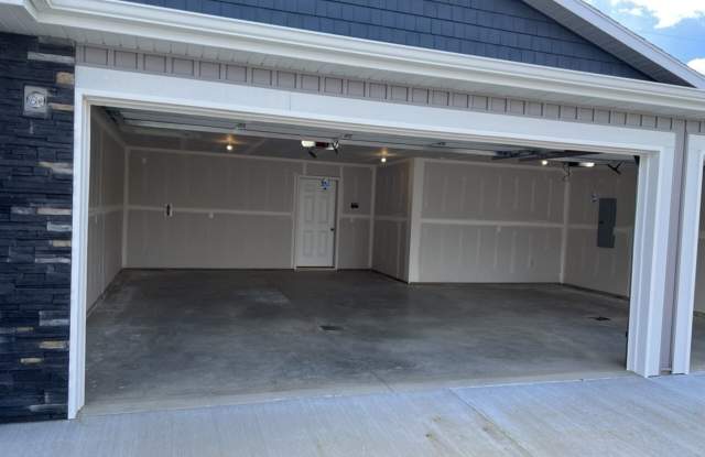 TWIN HOME IN SOUTH BISMARCK W/ HUGE 3 STALL GARAGE!