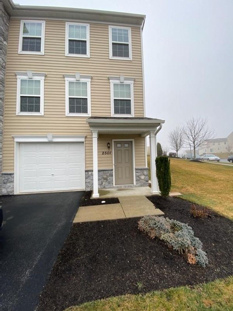 indoor outdoor living area in basement with garage door on Iny8vvmezimcdm
