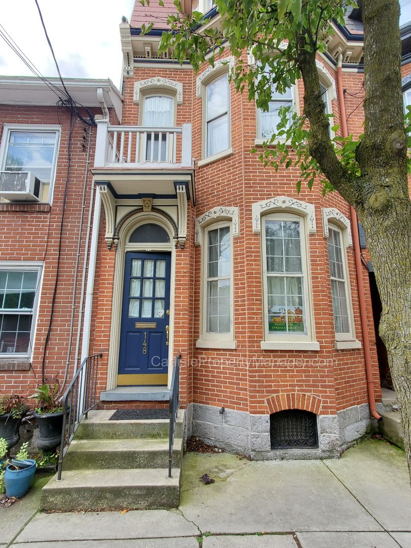Historic downtown Carlisle townhouse for rent with 4bd, 2.5ba, garage parking, patio,  fenced yard
