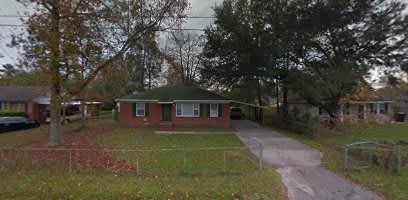 Brick Home with Carport and large fenced in yard