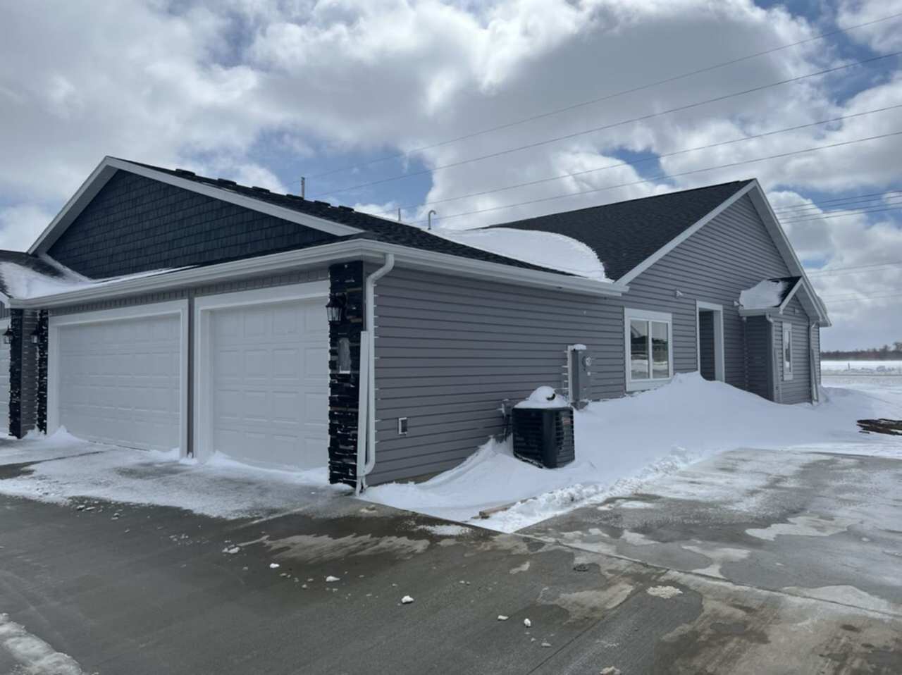 TWIN HOME IN SOUTH BISMARCK W/ HUGE 3 STALL GARAGE!