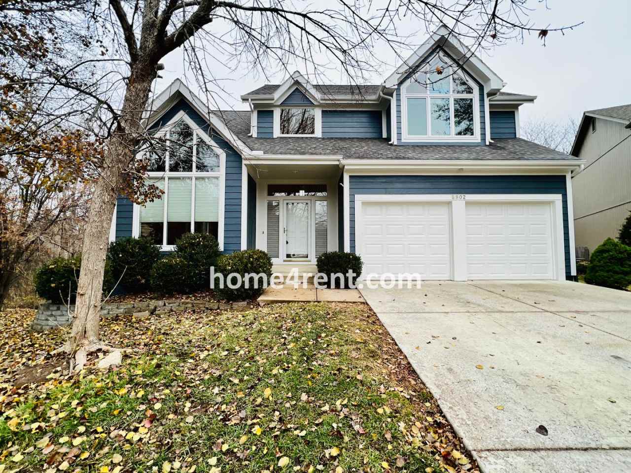 Beautiful Four Bedroom Home in Blue Valley Schools w/ Lots of Space, Wood Floors on the Main Level, Finished Basement and a Fenced Yard!