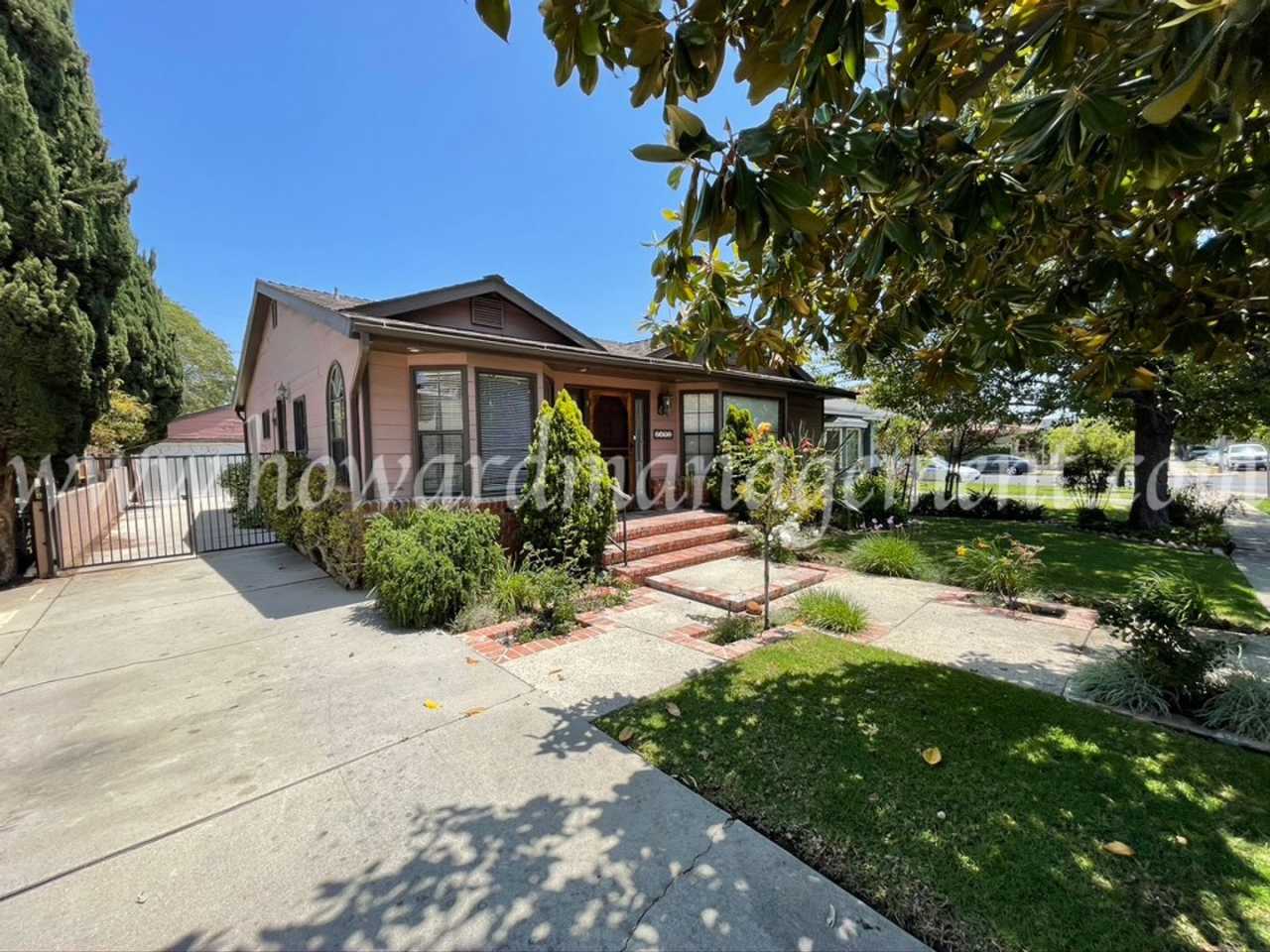 Charming one story house with lovely refinished hardwood floors and vaulted ceilings!