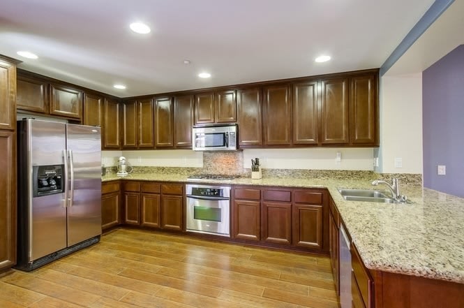 **Move in Special $1000 off 1st month's rent**Stunning 3-bed, 3.5 bath, tri-level condo w 2-car garage in Gianni Community