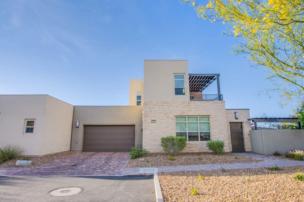 Absolutely gorgeous 2 bedroom 3.5 bathroom townhome with den in prestigious 55+ Trilogy community in Summerlin!