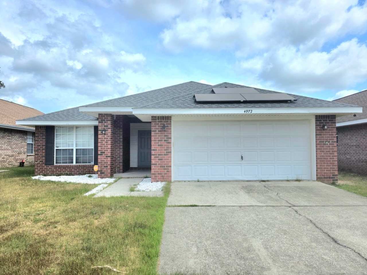 Charming 4BR/2BA Brick Home with Solar Panels