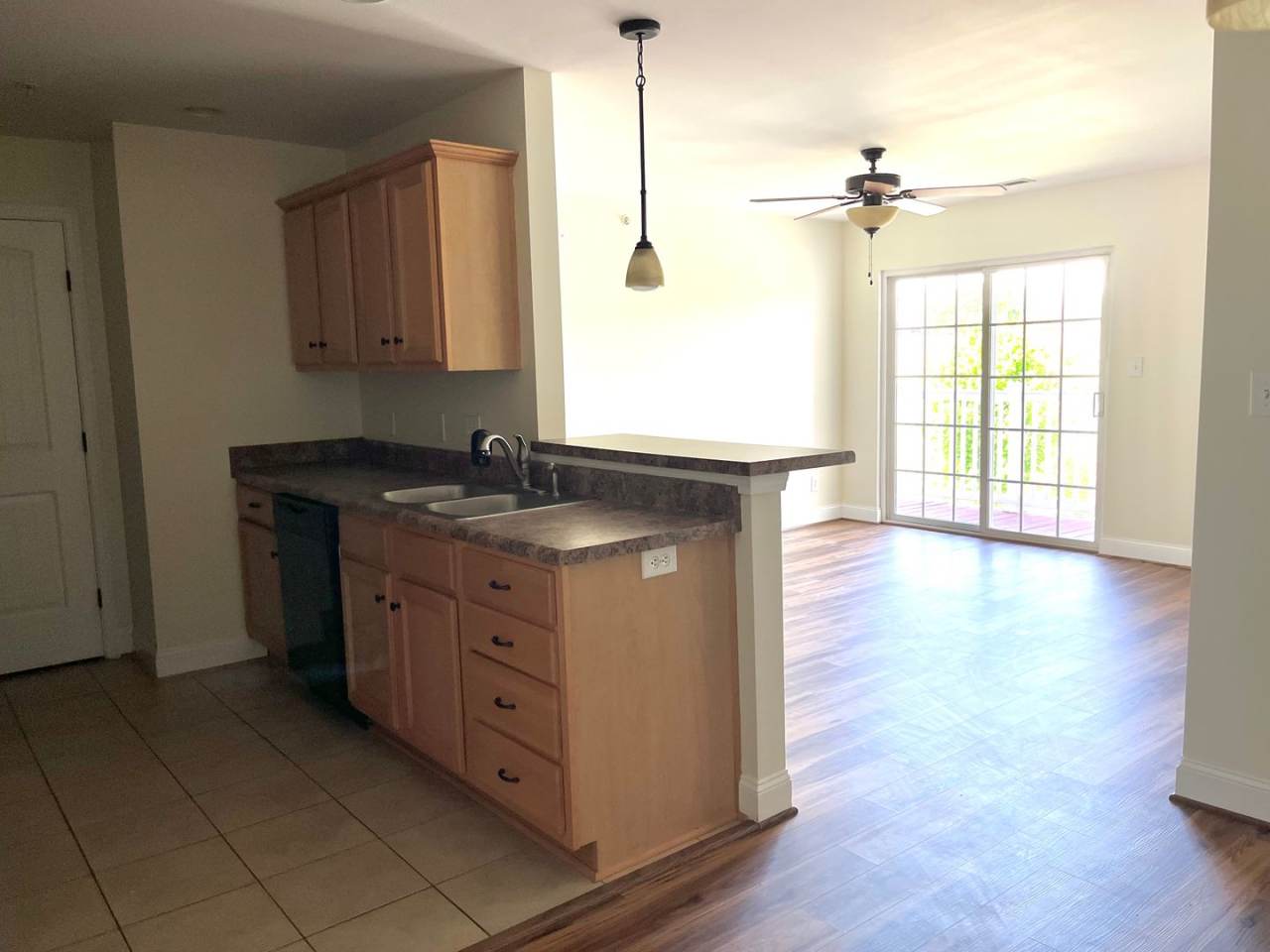 3 bedroom, 2 bath condo with balcony, new floors, and new paint.