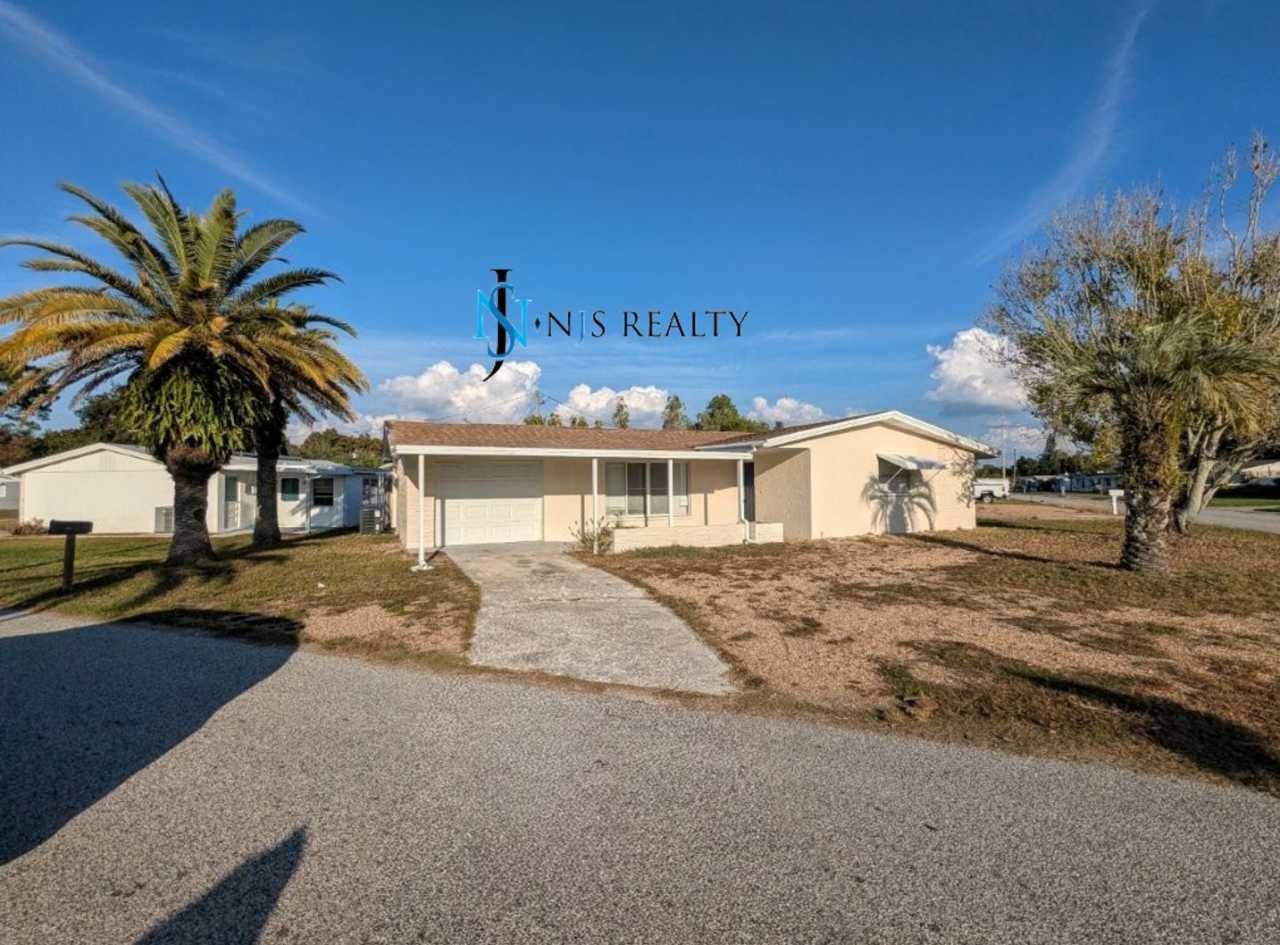 2/2/1 with RENOVATED baths  kitchen, fenced yard, NEW lvp flooring and a OVERSIZED lanai!