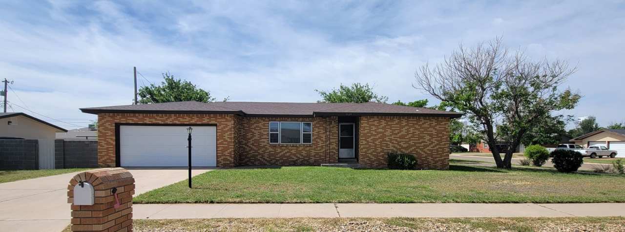 LARGE BRICK HOME CORNER LOT