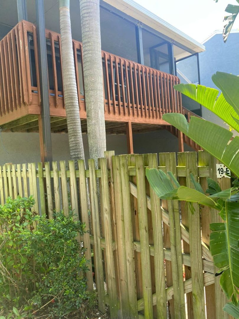 Great 2 bedroom 2 bath condo with screened balcony, private fenced courtyard and storage area