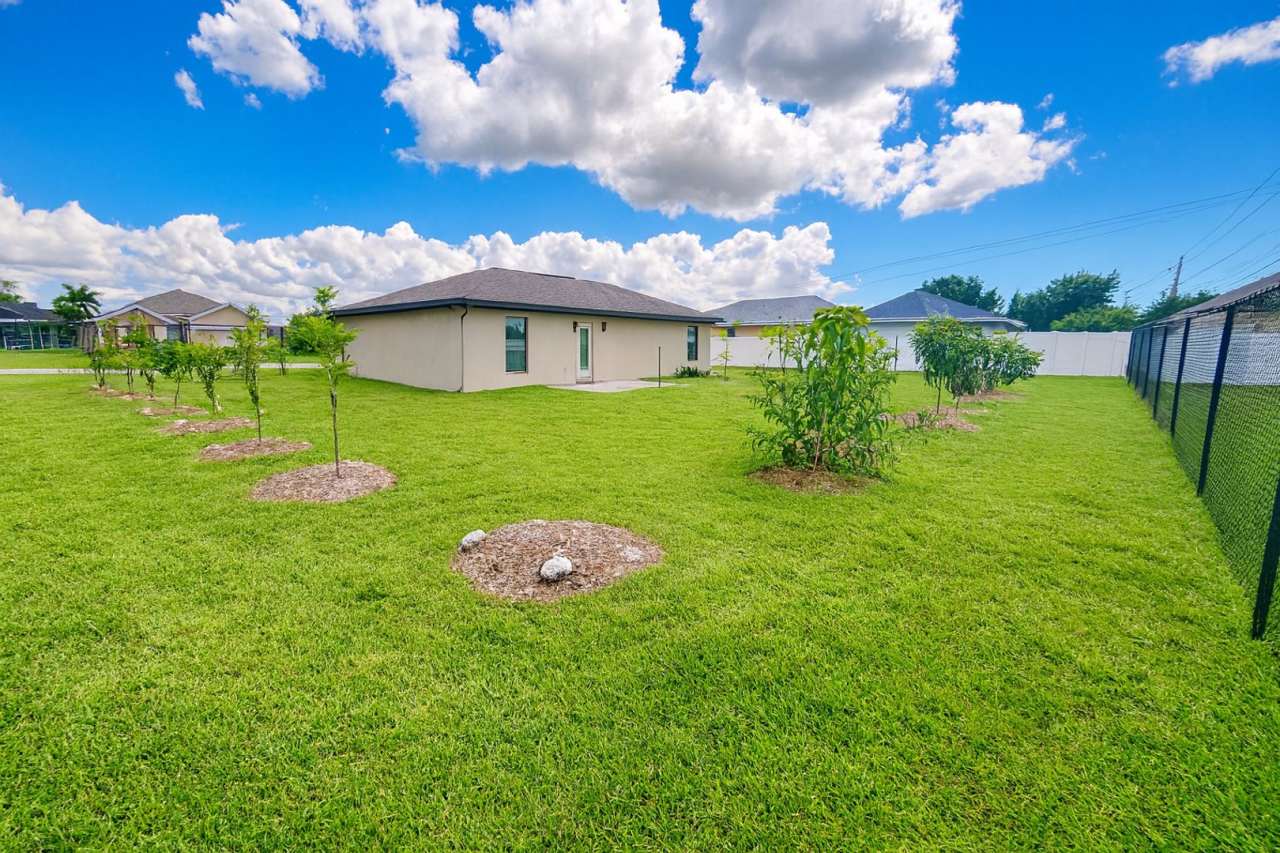 Spacious Modern Home on Triple Lot with Fenced Yard in SW Cape Coral!