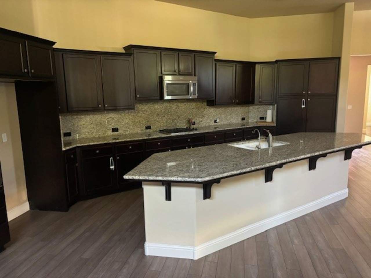 Move-In Ready: Elegant 4-Bedroom Home with Paid Solar in Gated Community