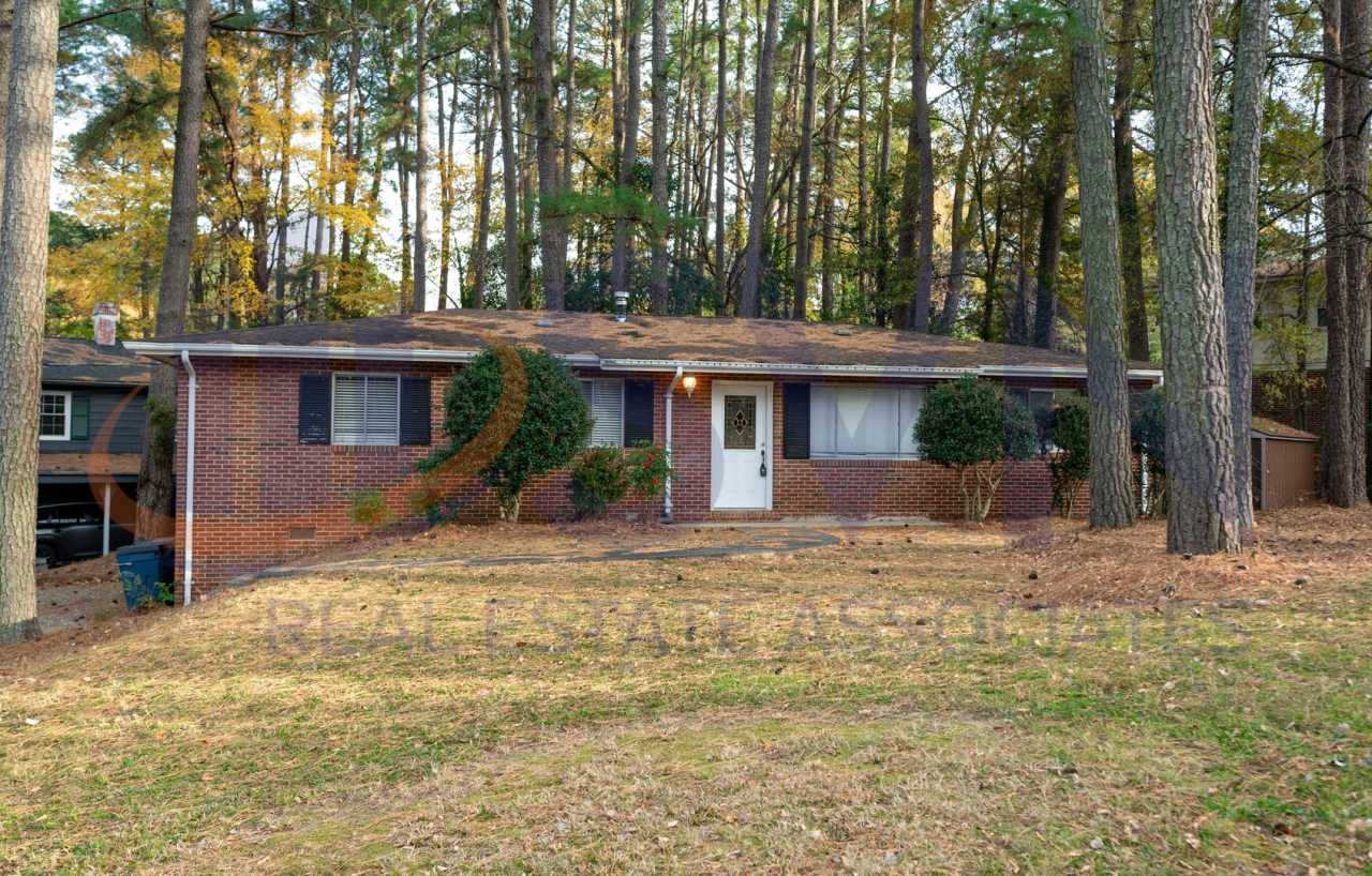 Charming Brick Ranch on a Spacious, Wooded Lot!