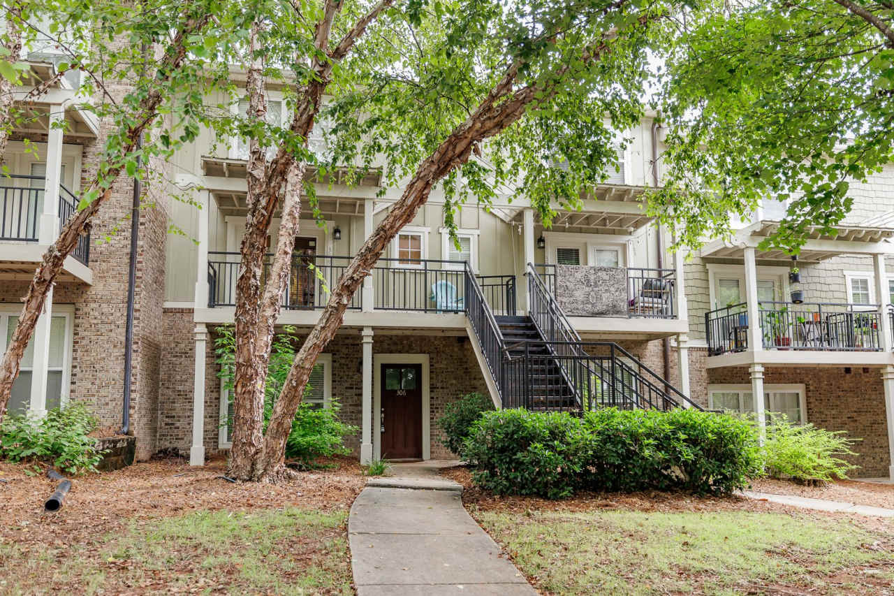 Ground-level, one-story condo in the highly sought-after gated community, The Woodlands of Athens!