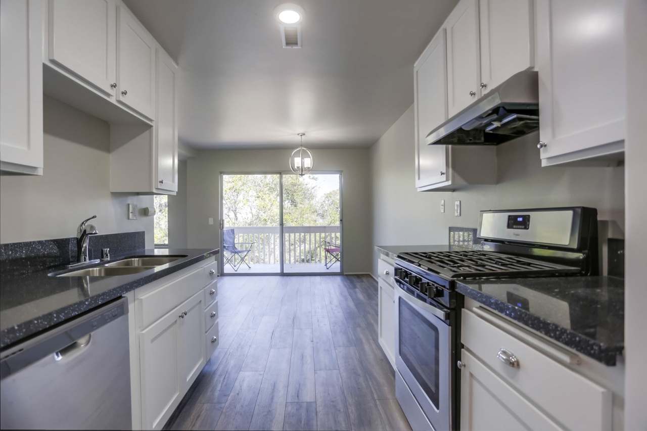 Price Reduced! 2 Bedroom Oceanside Condo, with Private Yard and One-Car Garage