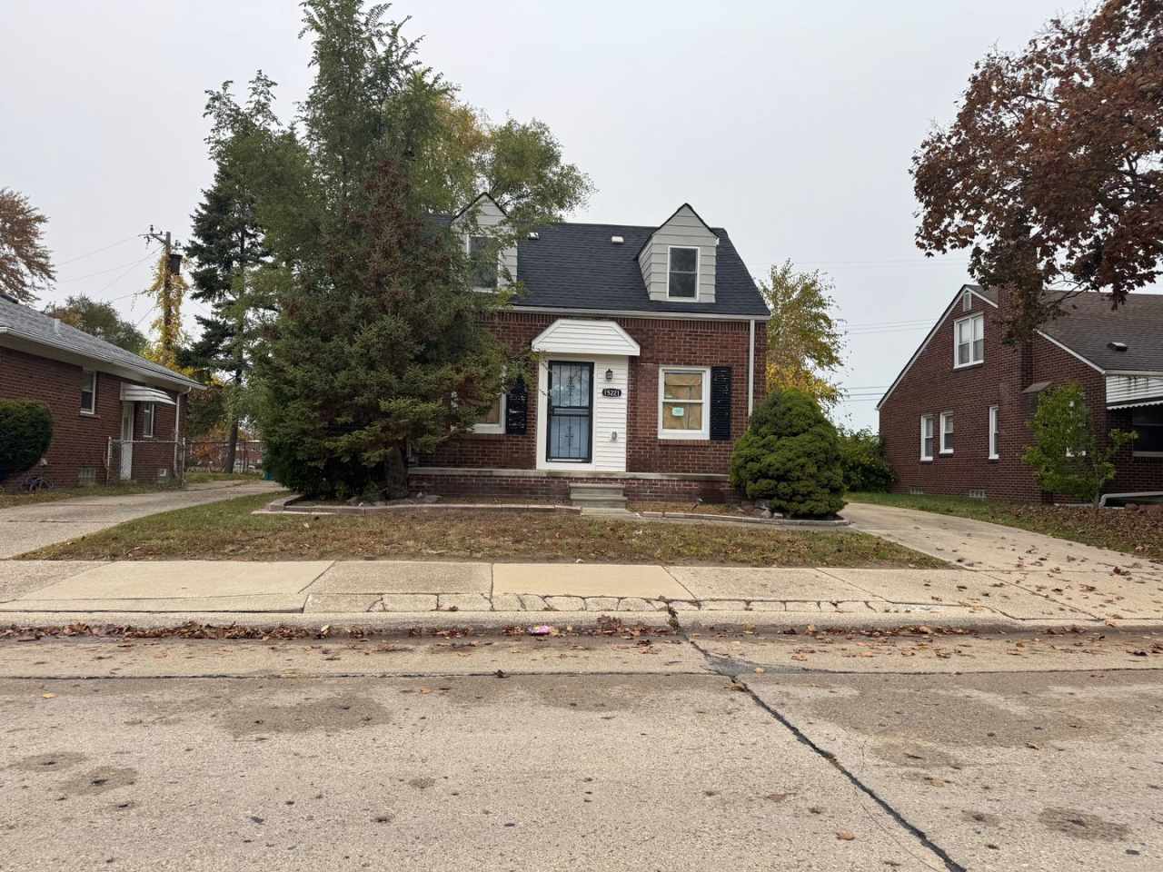 BRAND NEW KITCHEN, NEW FLOORS, FRESHLY PAINTED BRICK HOME WITH BASEMENT