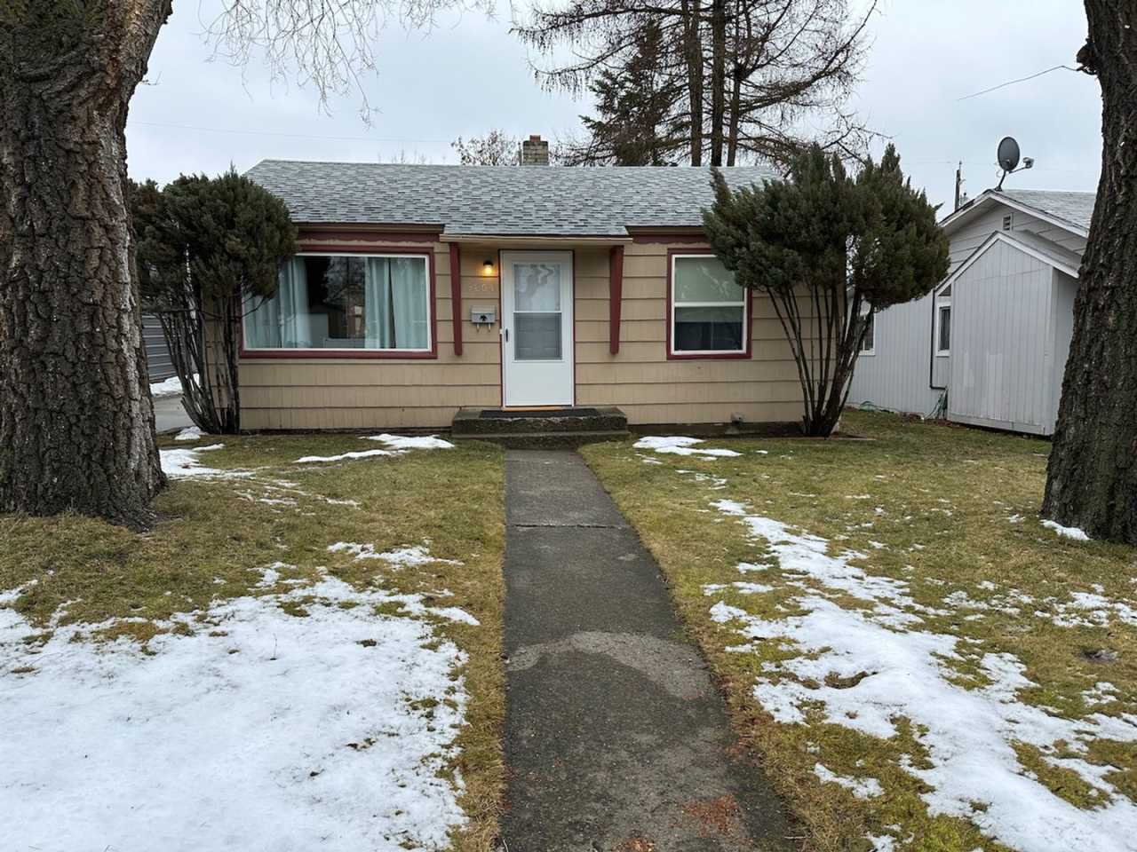 Cozy and Conveniently Located 2 Bed 1 Bath Spokane Home w/ Detached Garage  Heated Multipurpose Room!