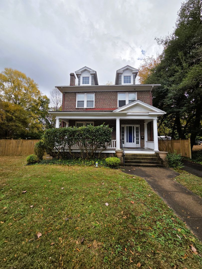 Renovated stately brick home in Forest Hill area on large lot.