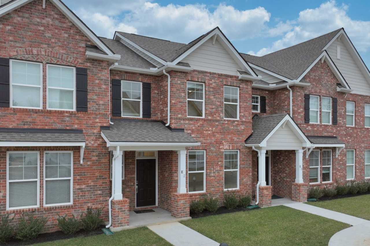 **BE THE FIRST PERSON TO LIVE IN THIS BRAND NEW BRICK TOWNHOME IN THE VILLAS AT REGAL SQUARE FEATURING A 2-CAR GARAGE WITH EPOXY FLOOR AND PRIVATE COURTYARD**