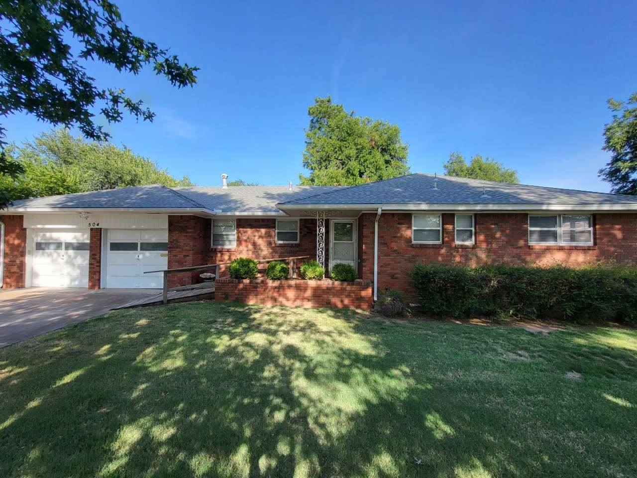 Remodeled 3 bedroom 2 bathroom house with 2 car garage and fenced yard