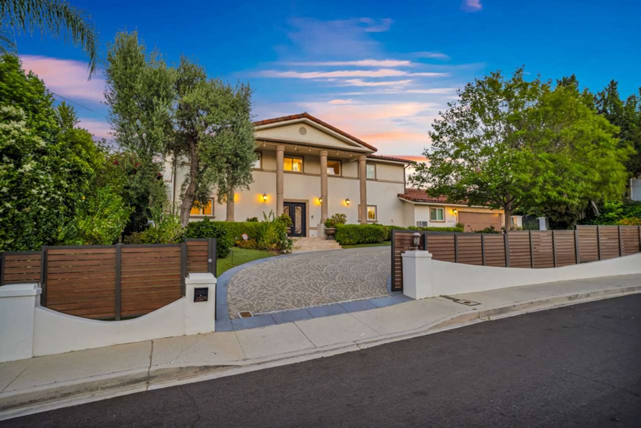 PRIVATE AND TRANQUIL COMPLETELY RENOVATED WOODLAND HILLS ESTATE!
