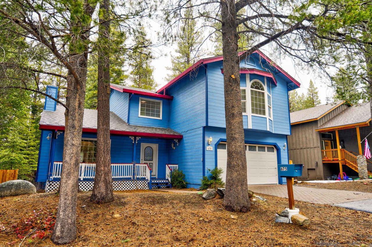 Large mountain home with 2 car garage and fenced in back yard.