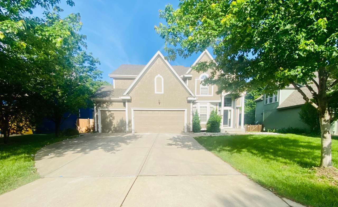 {15808} Hampton Place Two Story Home + Finished Basement + Three Car Garage + Blue Valley HS