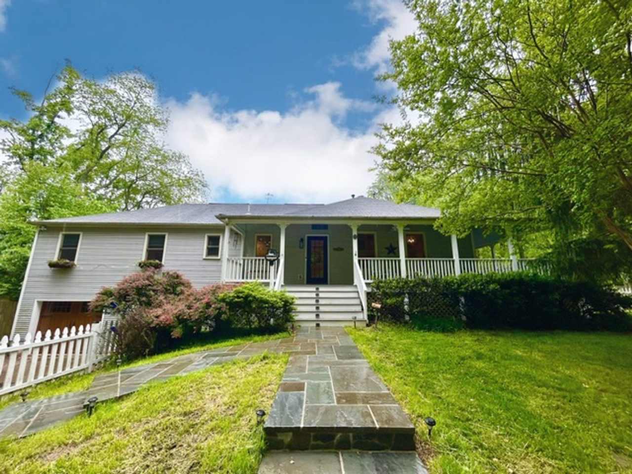 Beautifully renovated 4BR/3BA rambler with wraparound porch and garage