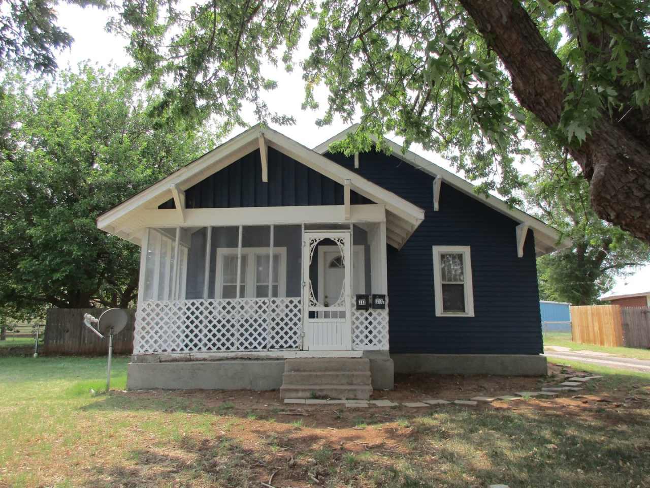 Cute Bungalow with a screened in front porch