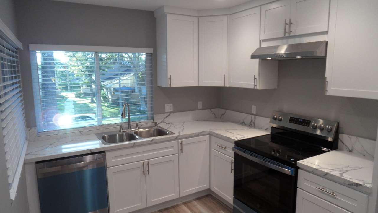 REMODELED 2BR; 1BA end unit condo w/ 1 car garage  1 parking space