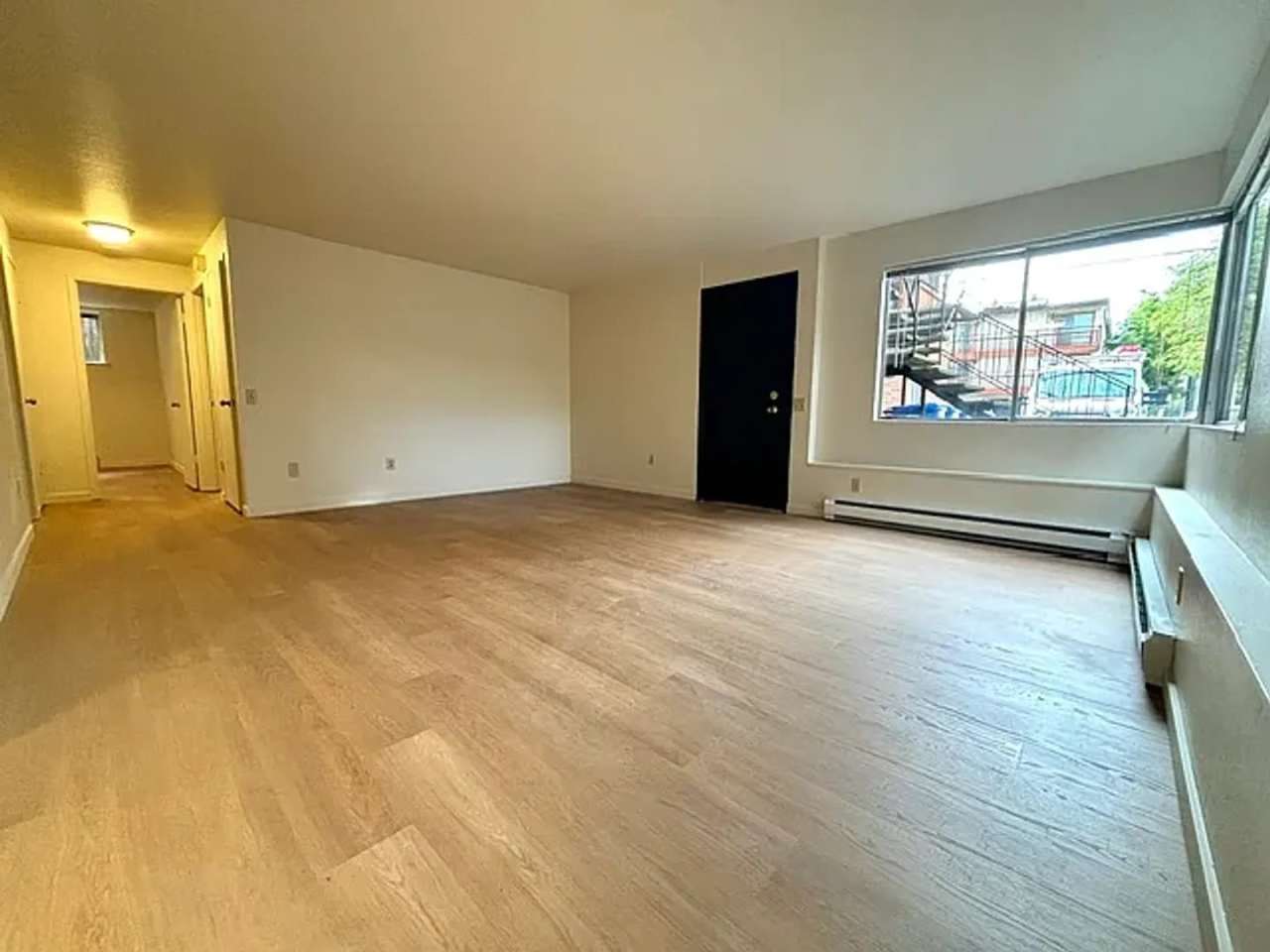 2 BD/ 1 BA ground level unit in triplex. Prime Ballard location w/off-street parking!