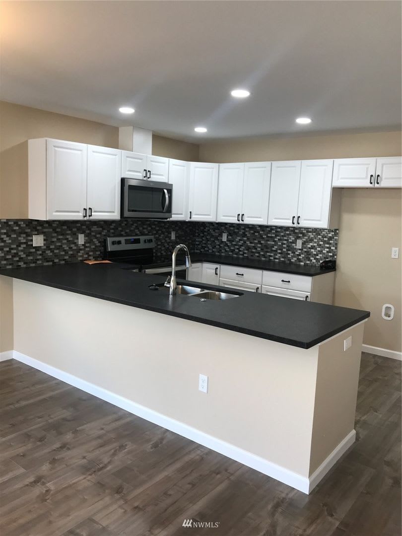 3-Bedroom Home with Garage and Fenced Yard in Prime Location