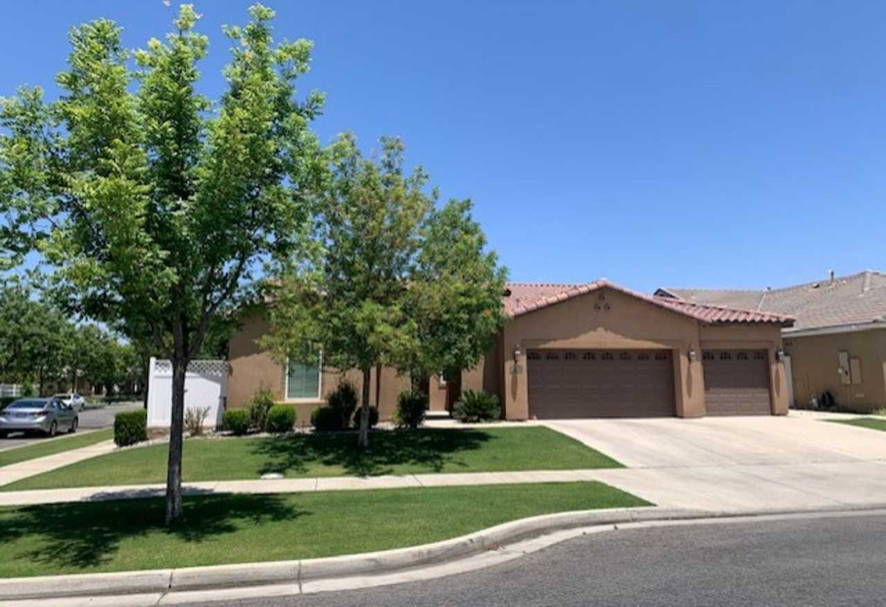 Elegant 4-Bedroom Home with Paid Solar in Gated Village Green Community