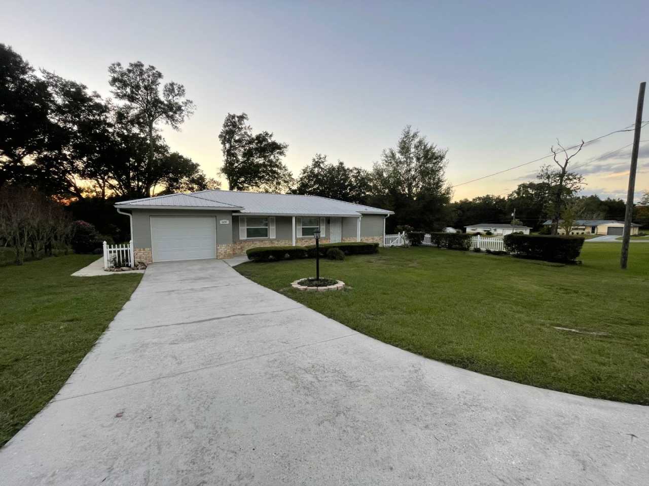 Beautiful 2/2 with large yard, Florida room, new floors, and updated bathrooms!