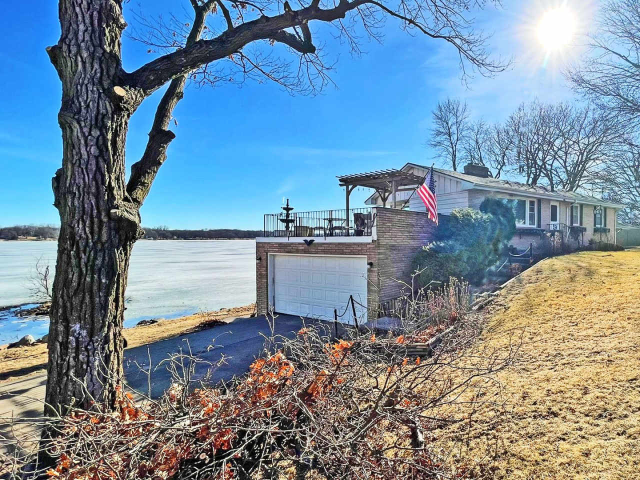 Spacious and Charming LAKEFRONT Home with 2 Fireplaces and Huge Lakefront Terrace!