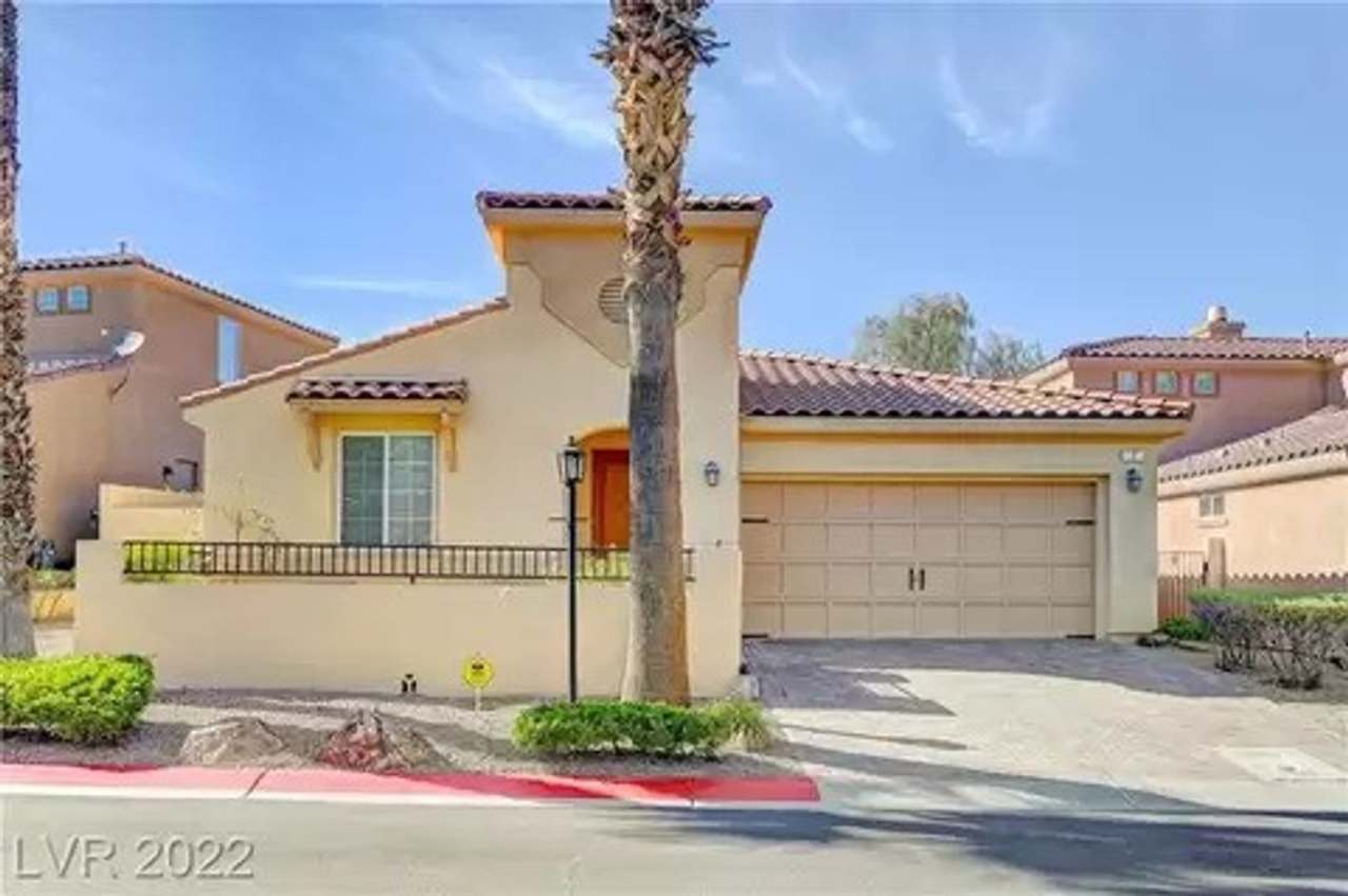 Exquisite fully furnished 2 Bed/2 Bath, Den/Office Single Story home in prestigious Lake Las Vegas. Strip and Golf Course Views