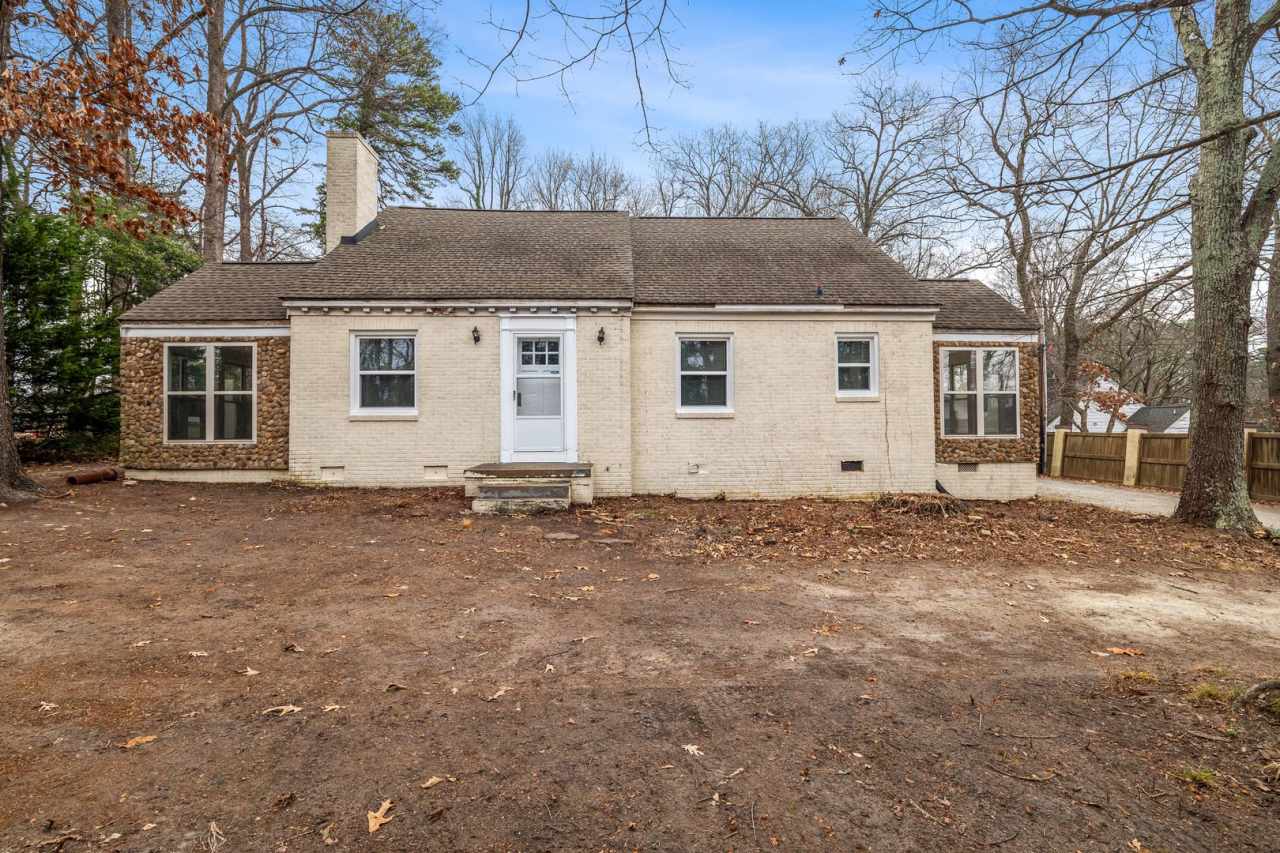 Brick home, Two Story, Hardwoods, DR, 2 Sun Rooms, FP, Carport!.