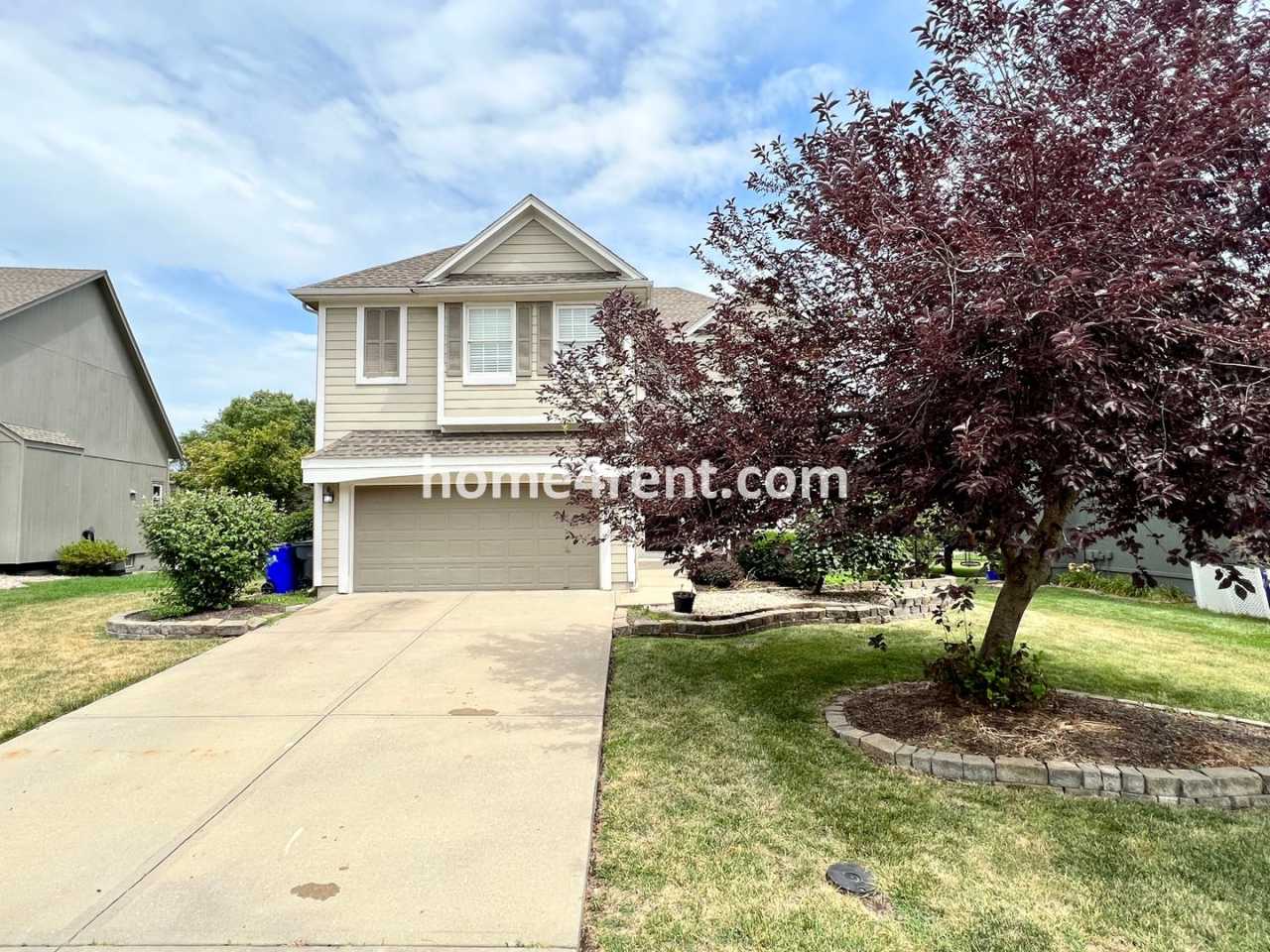 Updated Kitchen, Large Two Tiered Deck, Finished Basement in Blue Valley Schools!