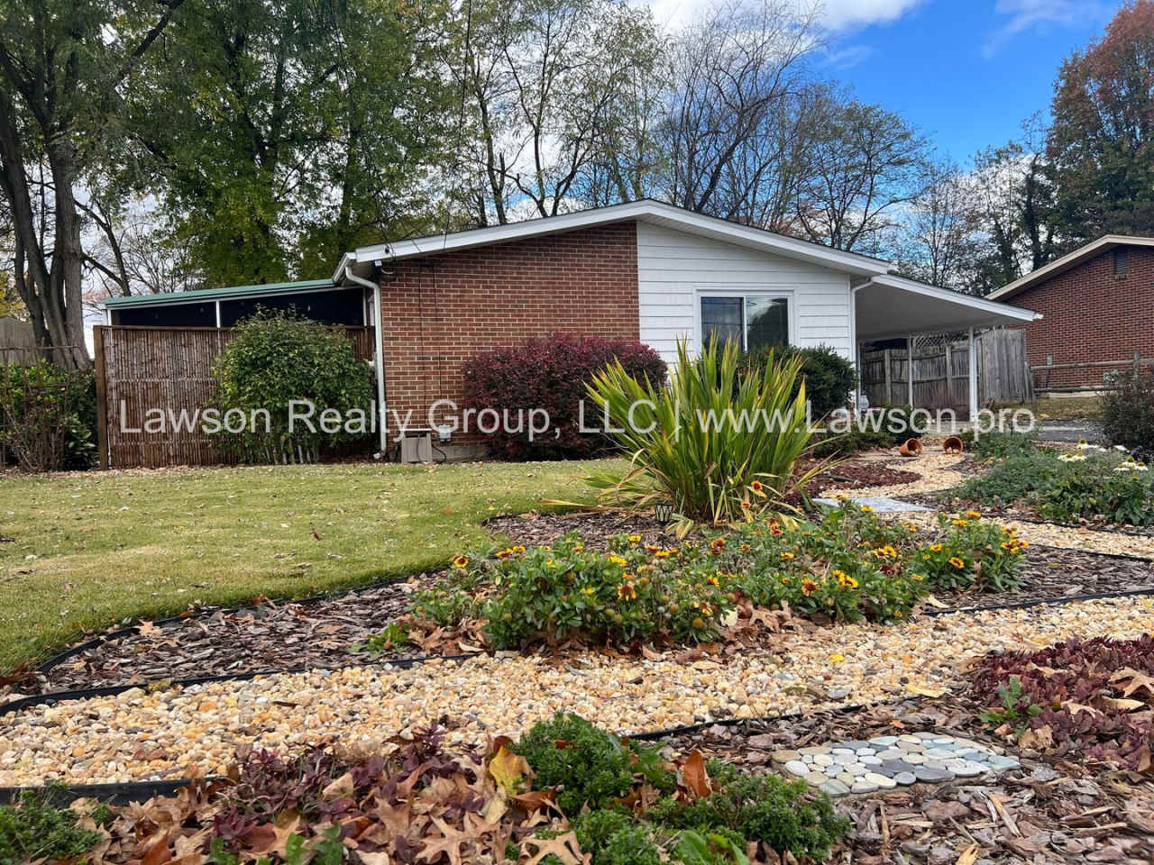 Charming Brick Ranch with Beautifully Landscaped Yard and Attached Carport