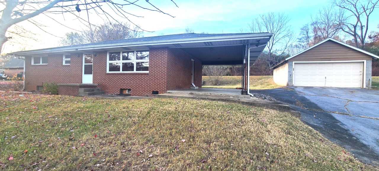 HALF OFF FIRST MONTH RENT! Single family brick home with full unfinished bsmt  detached garage