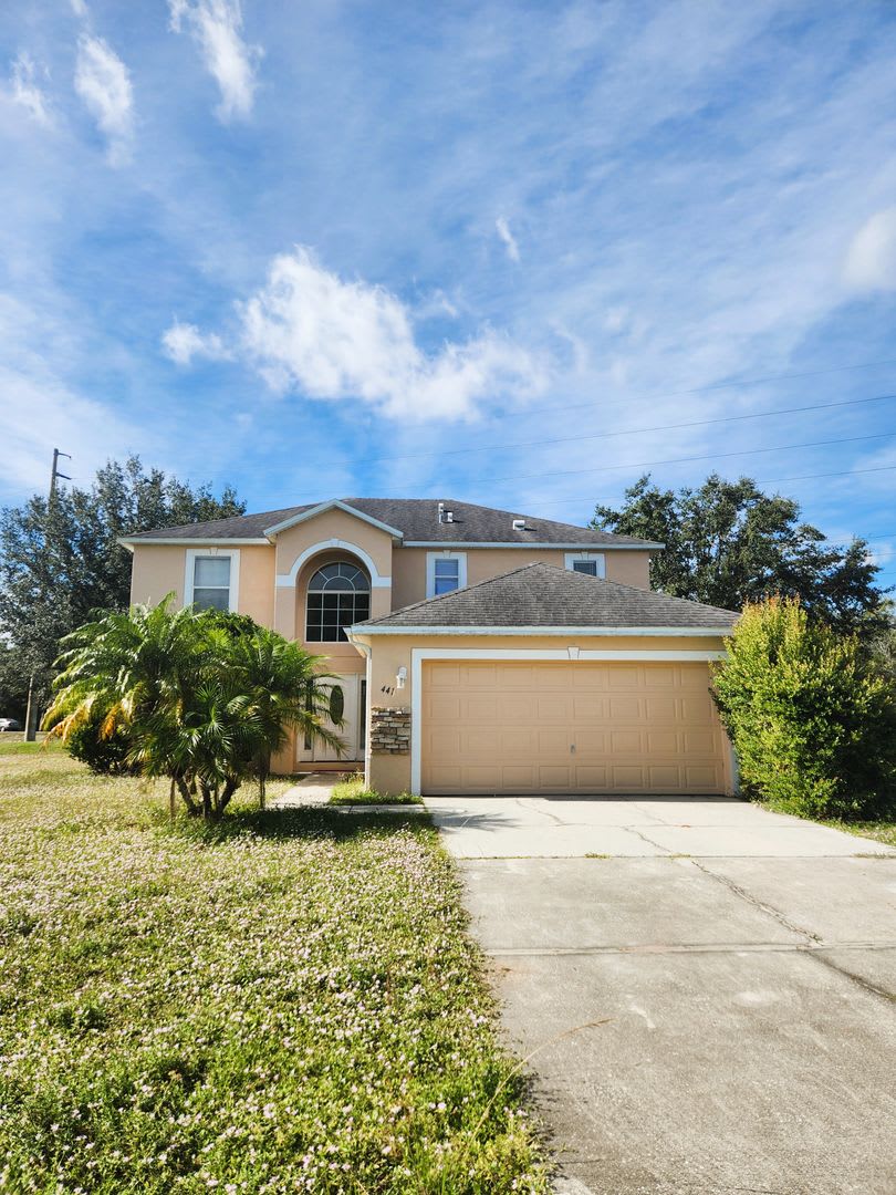 Stylish 2-Story Poinciana Home with Modern Comforts  Enclosed Porch Retreat