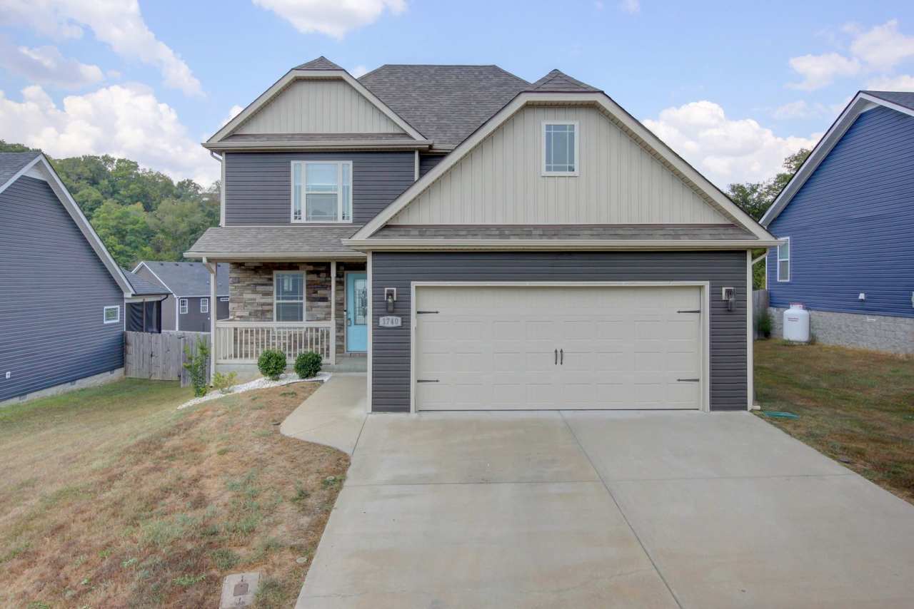 Beautiful Two Story Home With hardwood Flooring, Fireplace and Eat In Kitchen With Island